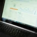 A laptop displaying an analytics dashboard with real-time data tracking and analysis tools.